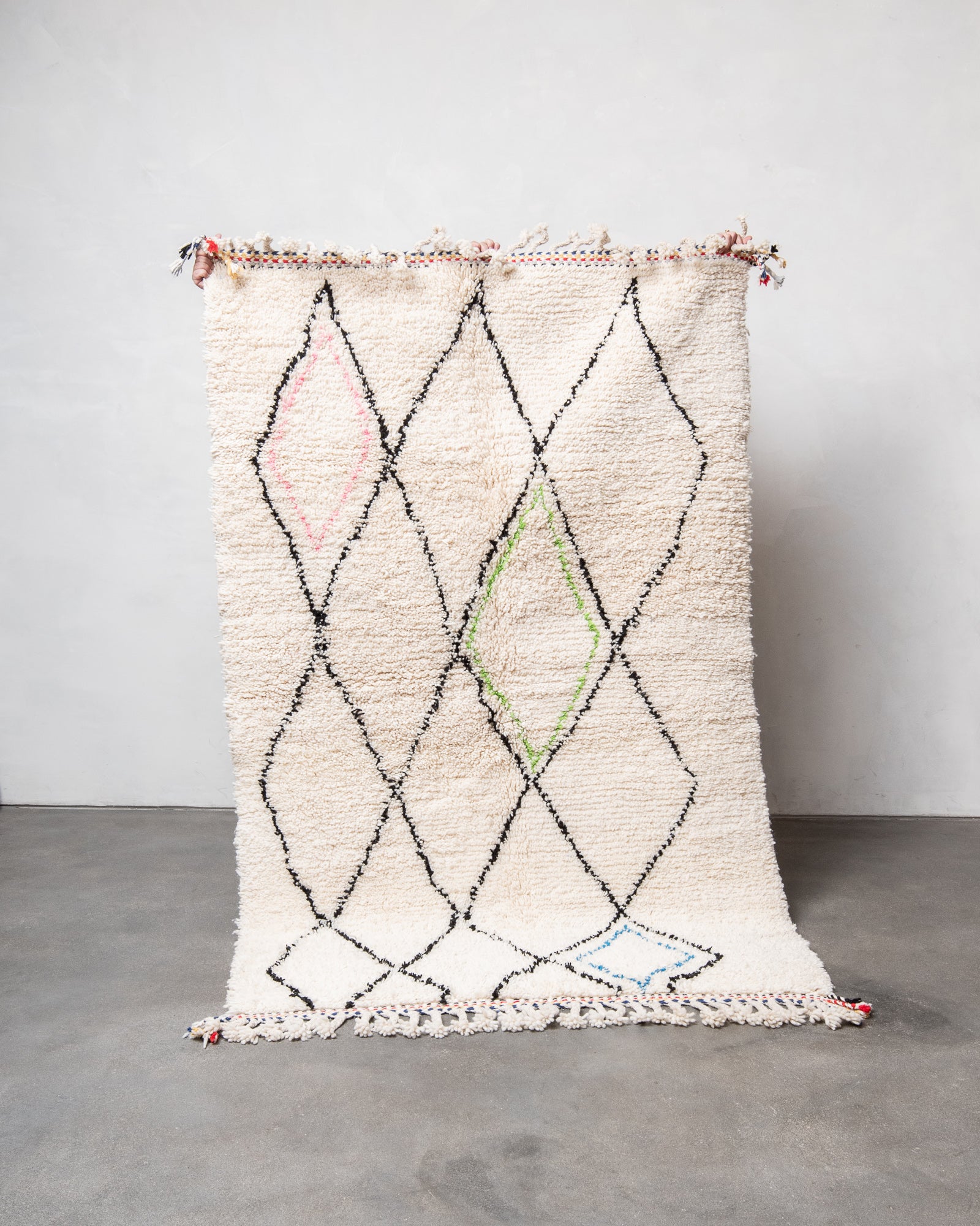 Modern, designer, handcrafted Berber rug from Morocco. Beniourain carpet with beautiful colours and patterns and fluffy wool texture.